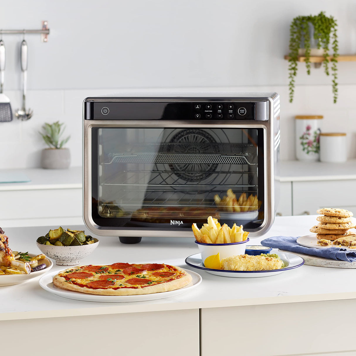 Ninja Foodi Horno multifunción 10 en 1, Mini horno portátil para encimeras y superficies de trabajo, 10 funciones de cocción, Freír con aire, Asar, Parrilla, Hornear y más, en plata y negro, DT200EU