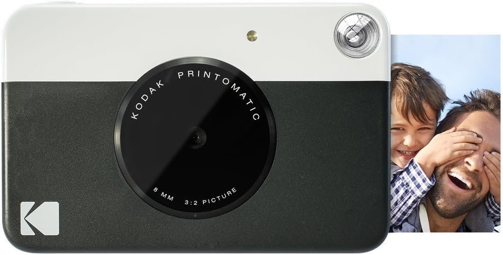 KODAK: Paquete cámara instantánea Printomatic (Negro) + Papel Zink (20 Hojas) + Funda álbum de Fotos + Marcos para Colgar + cómoda