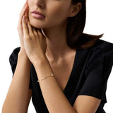 EMPORIO ARMANI Pulsera de mujer de acero inoxidable o latón con cierre de langosta en tono dorado, Amarillo dorado