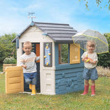 Smoby- Casa 4 Estaciones- para Aprender sobre Las Estaciones, Carillón de Viento, Veleta, Pluviómetro y Tablero Didáctico, A Partir de 2 años, Medidas: 102,7 x 121,8 x 143,4 cm (7600810731)