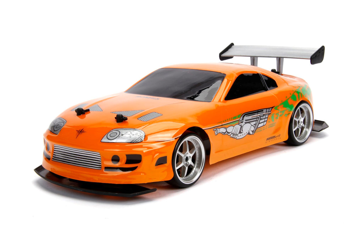 Jada Toys 253209003 Toys Fast & Furious RC Auto, Drift 1995 Toyota Supra, Turbo, función de Deriva, tracción en Las Cuatro Ruedas, Coche teledirigido, Mando a Distancia de 2 Canales, función de Carga