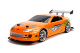 Jada Toys 253209003 Toys Fast & Furious RC Auto, Drift 1995 Toyota Supra, Turbo, función de Deriva, tracción en Las Cuatro Ruedas, Coche teledirigido, Mando a Distancia de 2 Canales, función de Carga