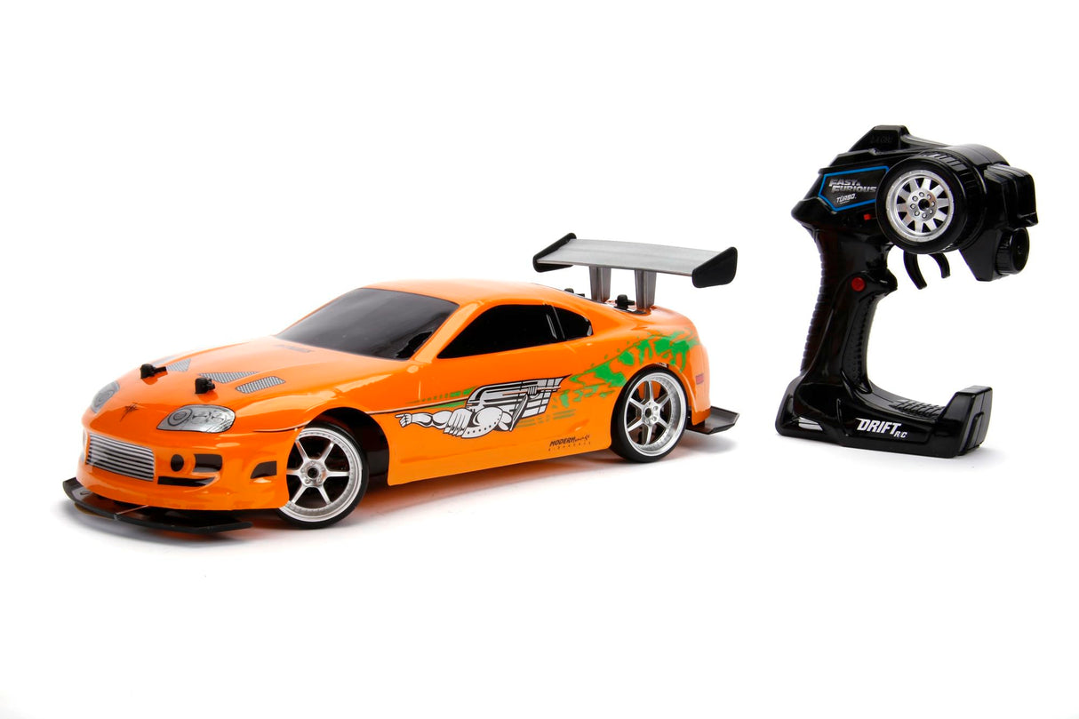 Jada Toys 253209003 Toys Fast & Furious RC Auto, Drift 1995 Toyota Supra, Turbo, función de Deriva, tracción en Las Cuatro Ruedas, Coche teledirigido, Mando a Distancia de 2 Canales, función de Carga