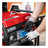 XGREENS Generador de corriente (gasolina) X70MTE (máx. 6.000W, depósito 40 l, AVR, Powered by Honda, eléctrico, ruedas, alerta aceite, trifásico, 3 tomas 230/400V, protección térmica y panel digital)