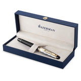 Pluma estilográfica Waterman Expert, en metal y lacado negro con adorno dorado, capuchón cincelado, plumín mediano de acero inoxidable