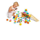 Lovevery | El Juego de Bloques | Bloques de Construcción y Piezas de Madera Maciza + Caja de Almacenaje de Madera, se Convierte en un Coche de Tracción, 70 Piezas, 20+ Actividades, Edad 12+ Meses