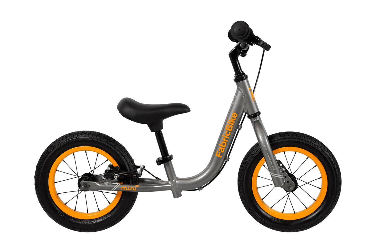FabricBike Mini 12" - Bicicleta sin Pedales para niños, 18 Meses - 3 años. Bici Ultraligera de Aprendizaje con Manillar y Sillín Ajustables. (Mini Pro Graphite & Orange)
