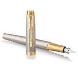 PARKER IM, pluma estilográfica de color plateado cálido Premium, con plumín fino y recambio de tinta azul (1931684)
