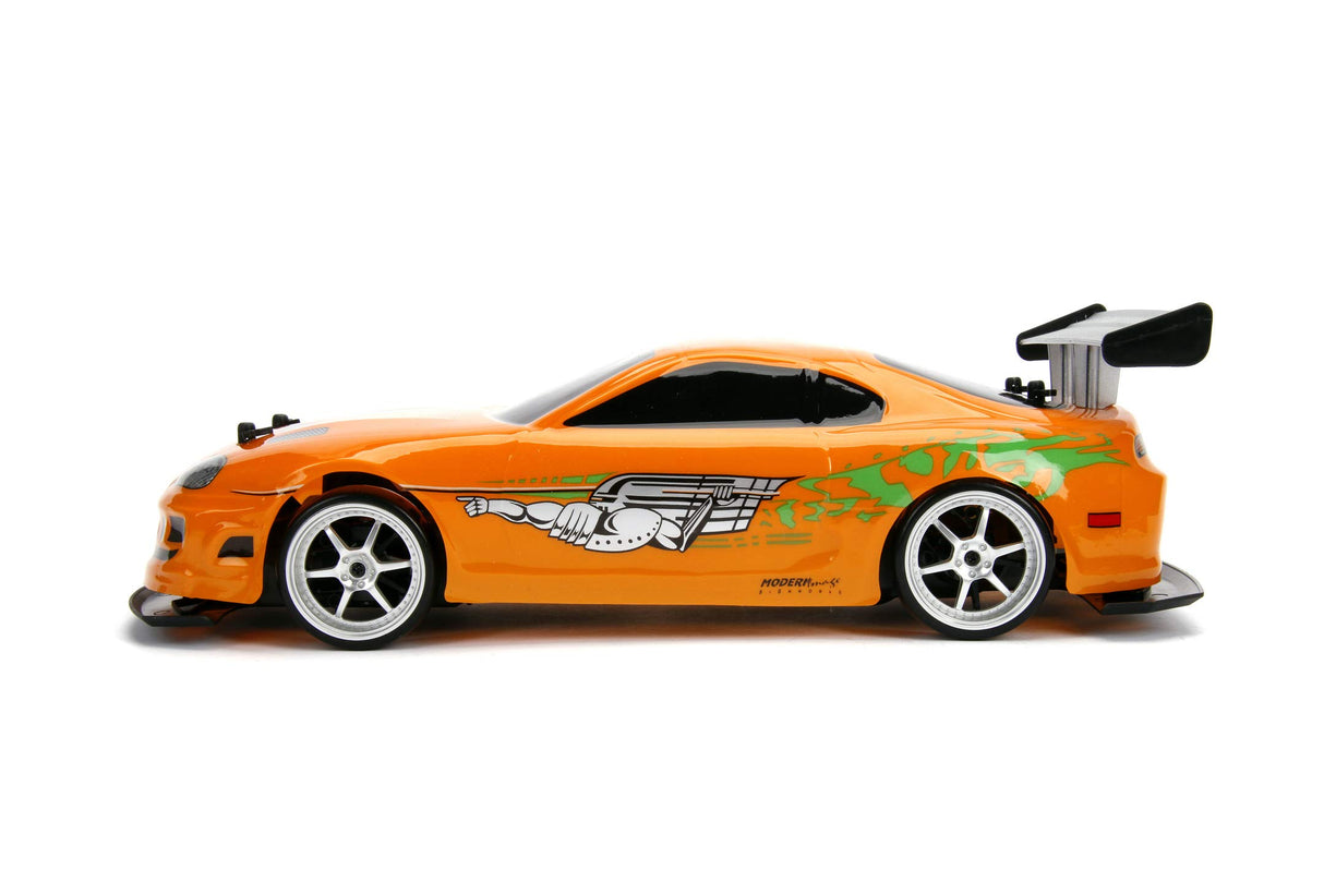 Jada Toys 253209003 Toys Fast & Furious RC Auto, Drift 1995 Toyota Supra, Turbo, función de Deriva, tracción en Las Cuatro Ruedas, Coche teledirigido, Mando a Distancia de 2 Canales, función de Carga