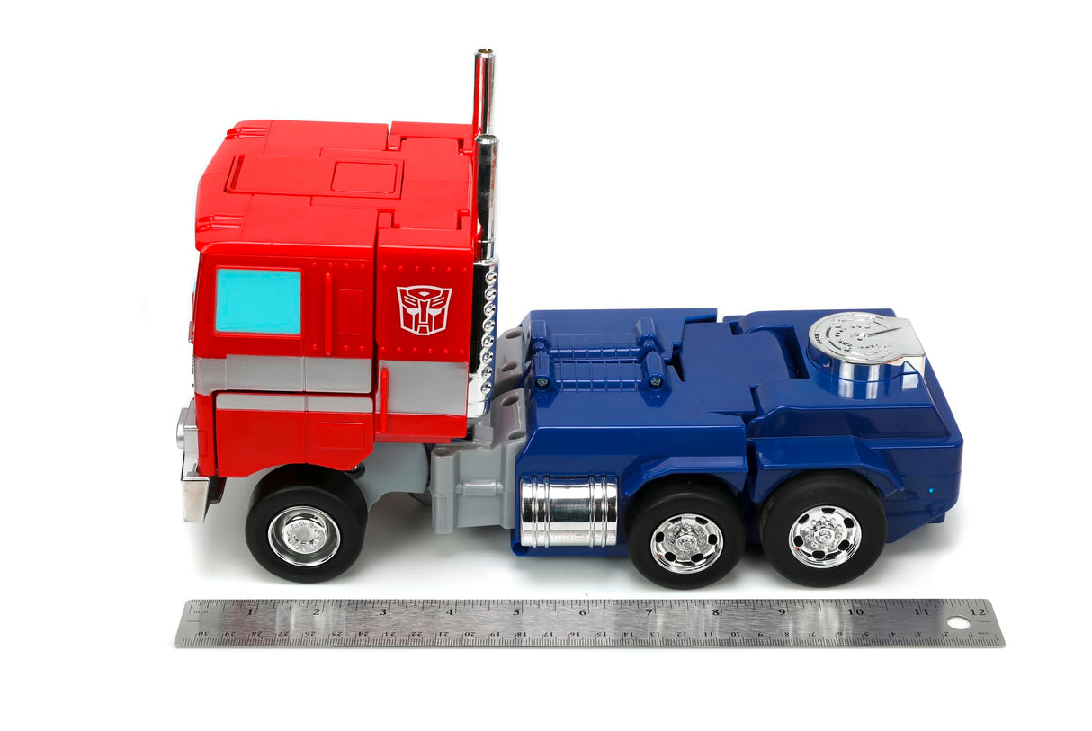 Jada Transformers Converting RC Optimus Prime - Coche de Control Remoto Modelo G1 Original - 30 cm de Largo en Modo camión, pie 35 cm de Alto Convertido en Modo Autobot con Luces Sonidos y Voz