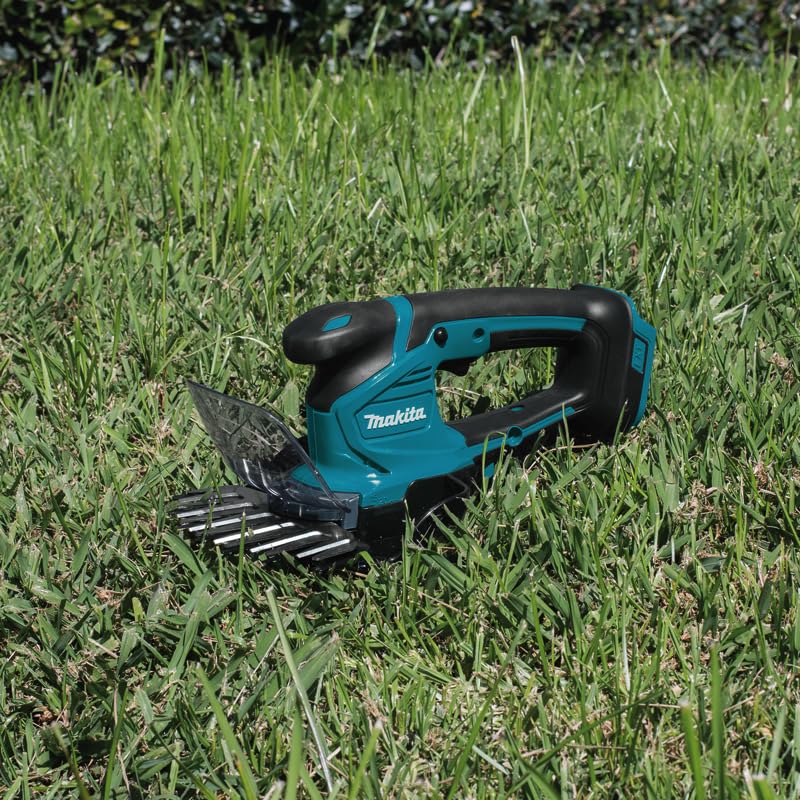 Makita DUM604RFX1 - Tijeras de césped (18 V, 3,0 Ah, 1 batería y Cargador, Incluye alargador de Mango con Rueda)