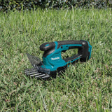 Makita DUM604RFX1 - Tijeras de césped (18 V, 3,0 Ah, 1 batería y Cargador, Incluye alargador de Mango con Rueda)