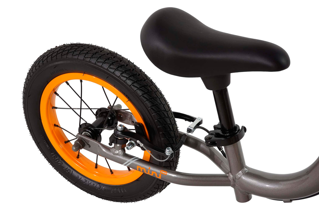 FabricBike Mini 12" - Bicicleta sin Pedales para niños, 18 Meses - 3 años. Bici Ultraligera de Aprendizaje con Manillar y Sillín Ajustables. (Mini Pro Graphite & Orange)
