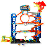 Hot Wheels City “Let's Race - ¡a Correr!” Netflix - Garaje definitivo Pista para Coches de Juguete con dragón y 4 Niveles, Incluye 2 vehículos, +4 años (Mattel HKX48)