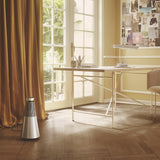 Bang & Olufsen Beosound 2 (3.ª Gen), Elegante y potente altavoz WiFi para el hogar con sonido envolvente de 360 grados, de pie o para estantería, Gold Tone