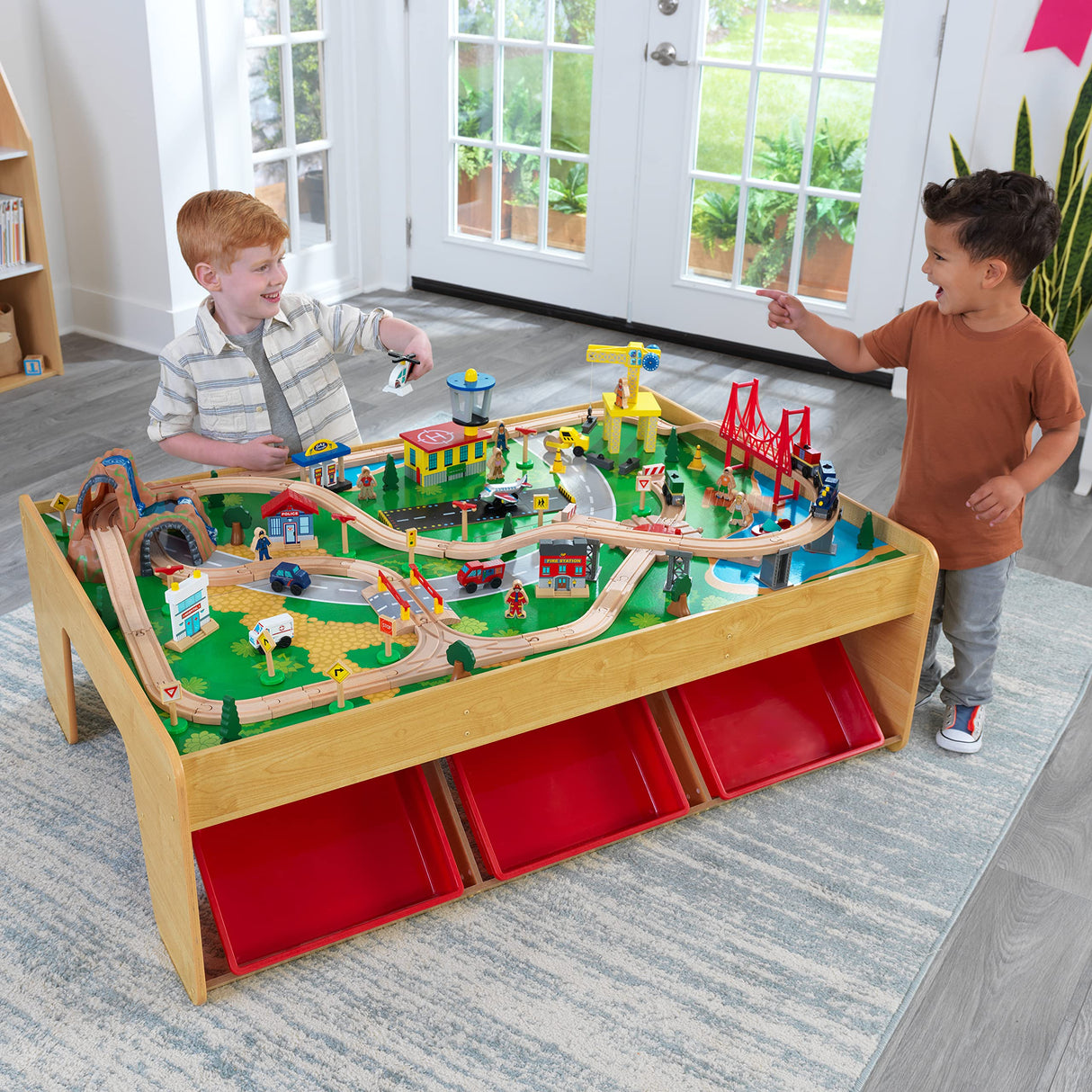 KidKraft Juego de Tren y Mesa de Madera Waterfall Mountain con Cajas de Almacenamiento, Circuito de ferroviarias con Coches, helicóptero y avión de Juguete niños 3+ años (17850)