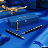 Waterman Expert bolígrafo, color negro brillante con adorno cromado, punta media con cartucho de tinta azul, estuche de regalo